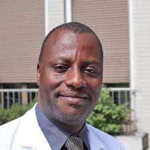 Dr. Andrew D Kambugu